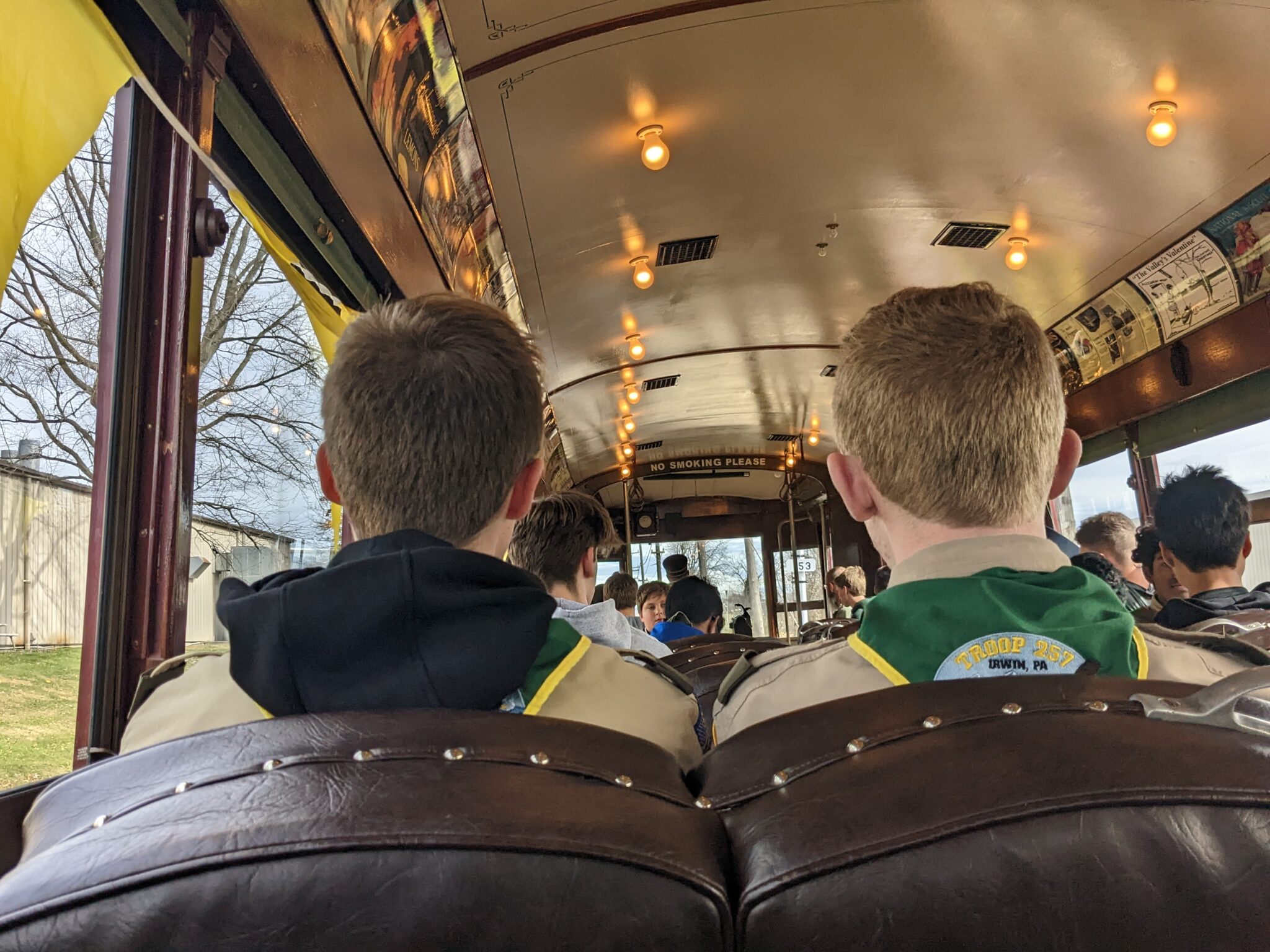 Scouts riding on a streetcar