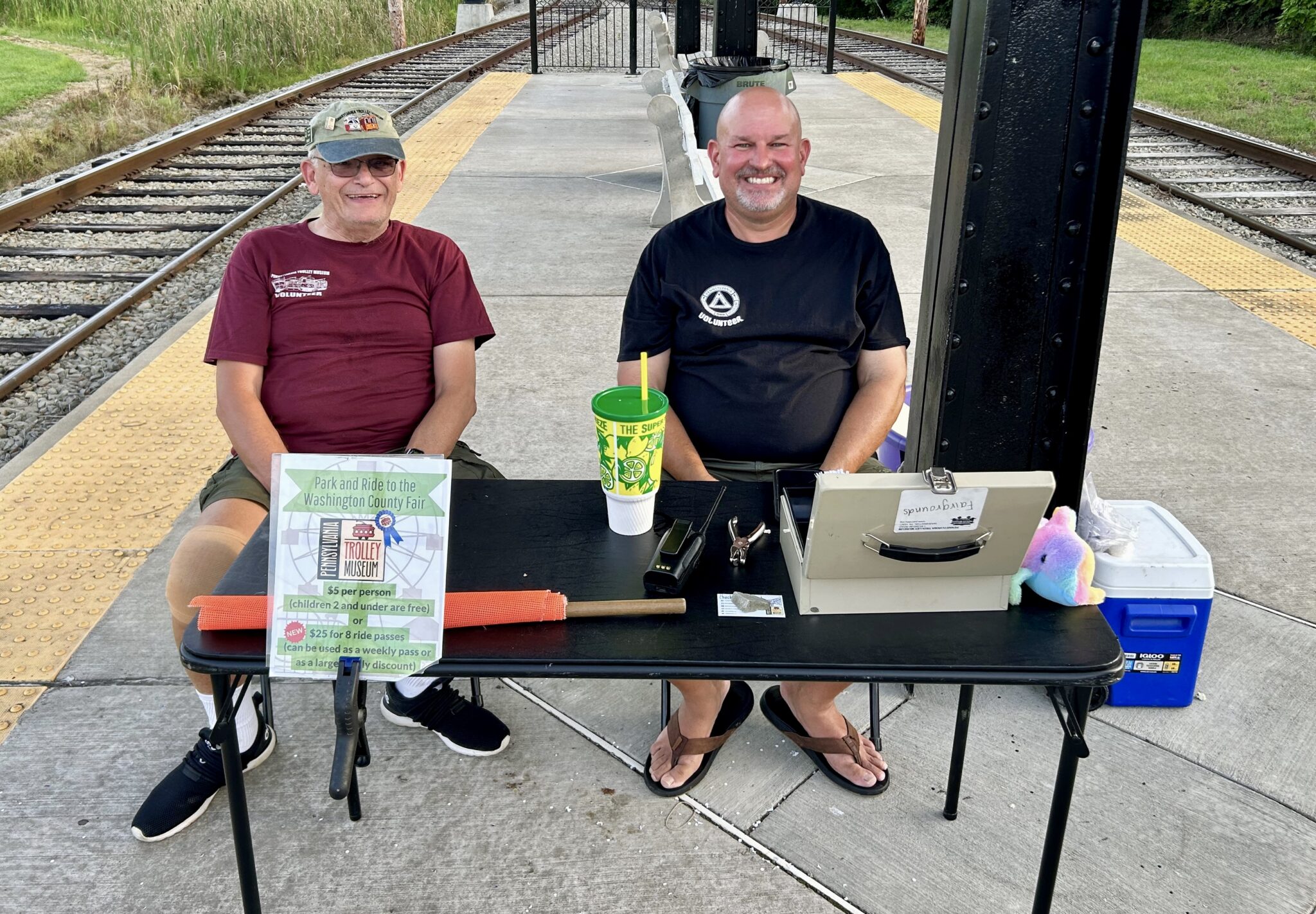 Don Bailey And Mike Kendlick Sell Tickets At Fairgrounds Platform 8-13-23. Scott Becker Photo (1)