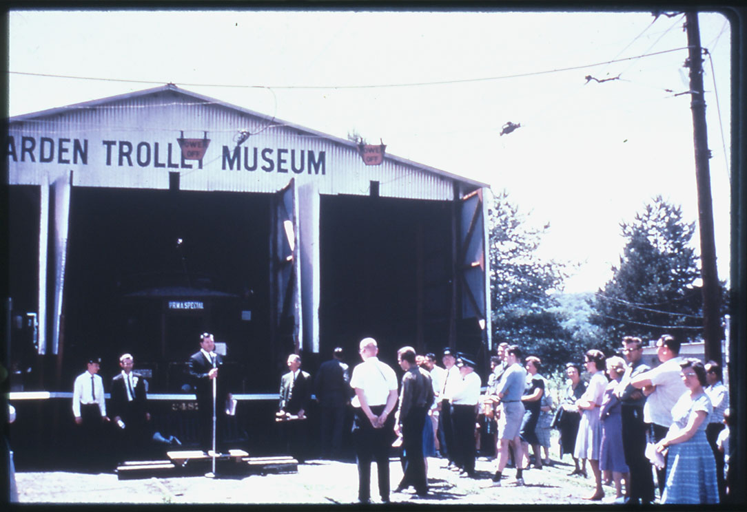 Carbarn Dedication - people standing in front of Arden Trolley Museum Barn in 1960s ceremony