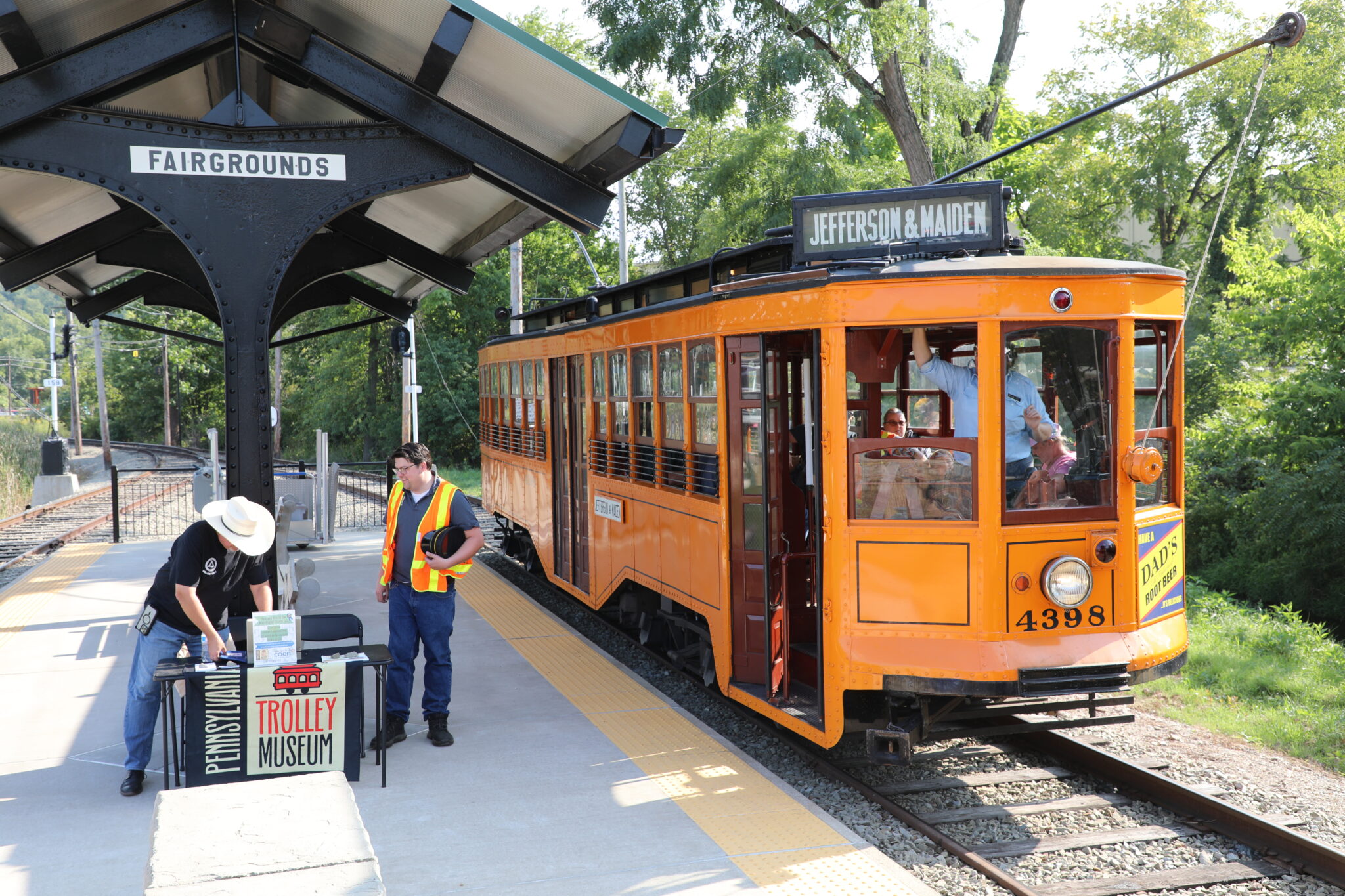 Car 4398 boards at Fairgrounds platform canopy